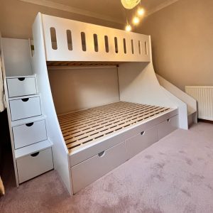 single over double bunk beds with slide and stairs close view