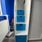 Double bunk beds with stairs and safety rails