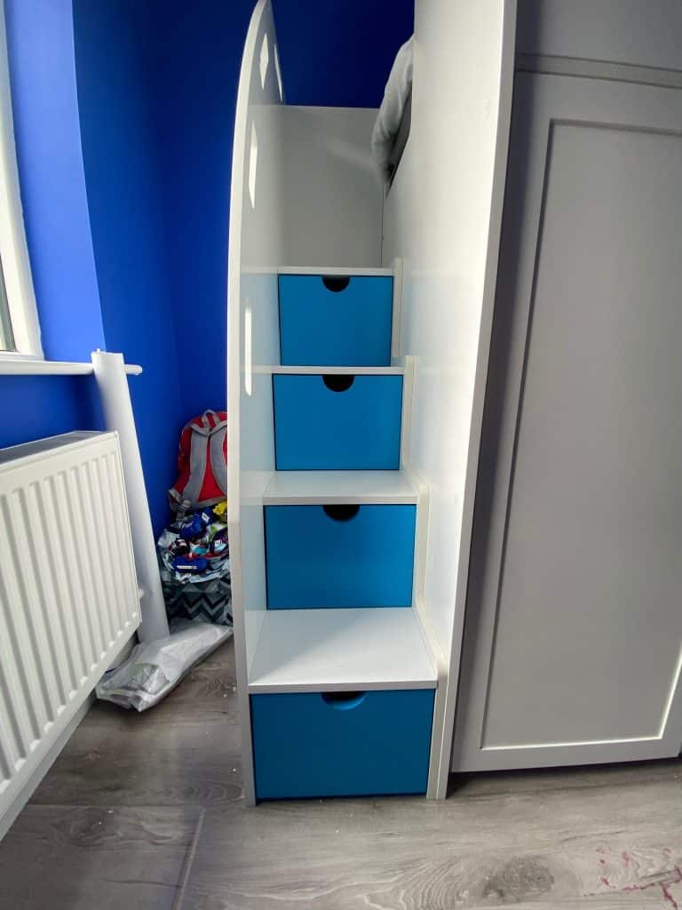 Double bunk beds with stairs and safety rails