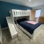 L-shaped double single bunk bed with stairs and safety rails