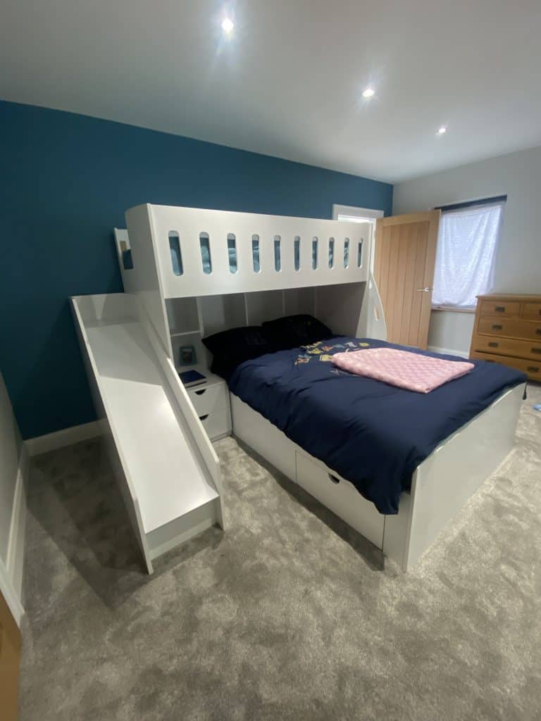L-shaped double single bunk bed with stairs and safety rails